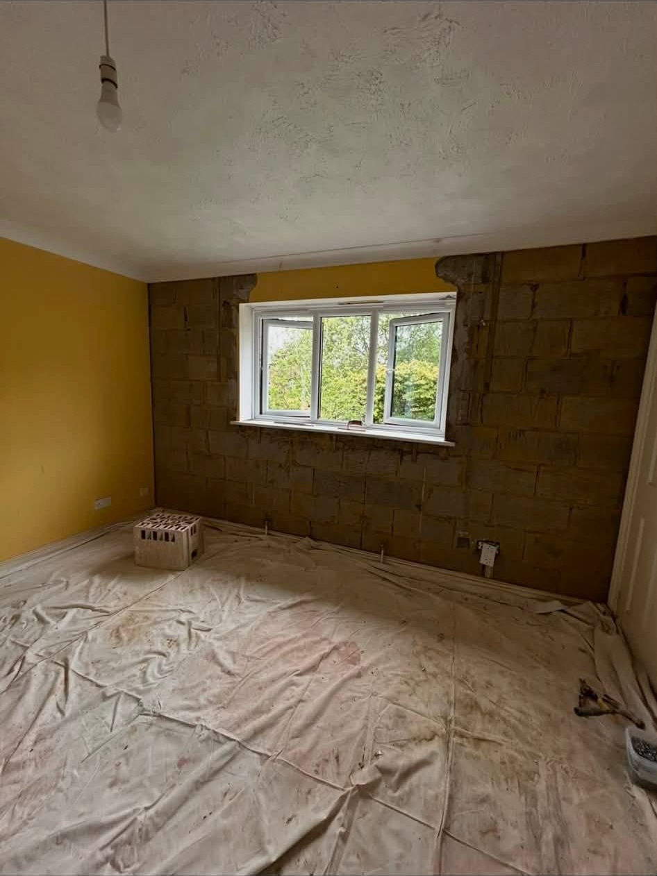The same bedroom with the blown backing coat removed down to the blockwork
