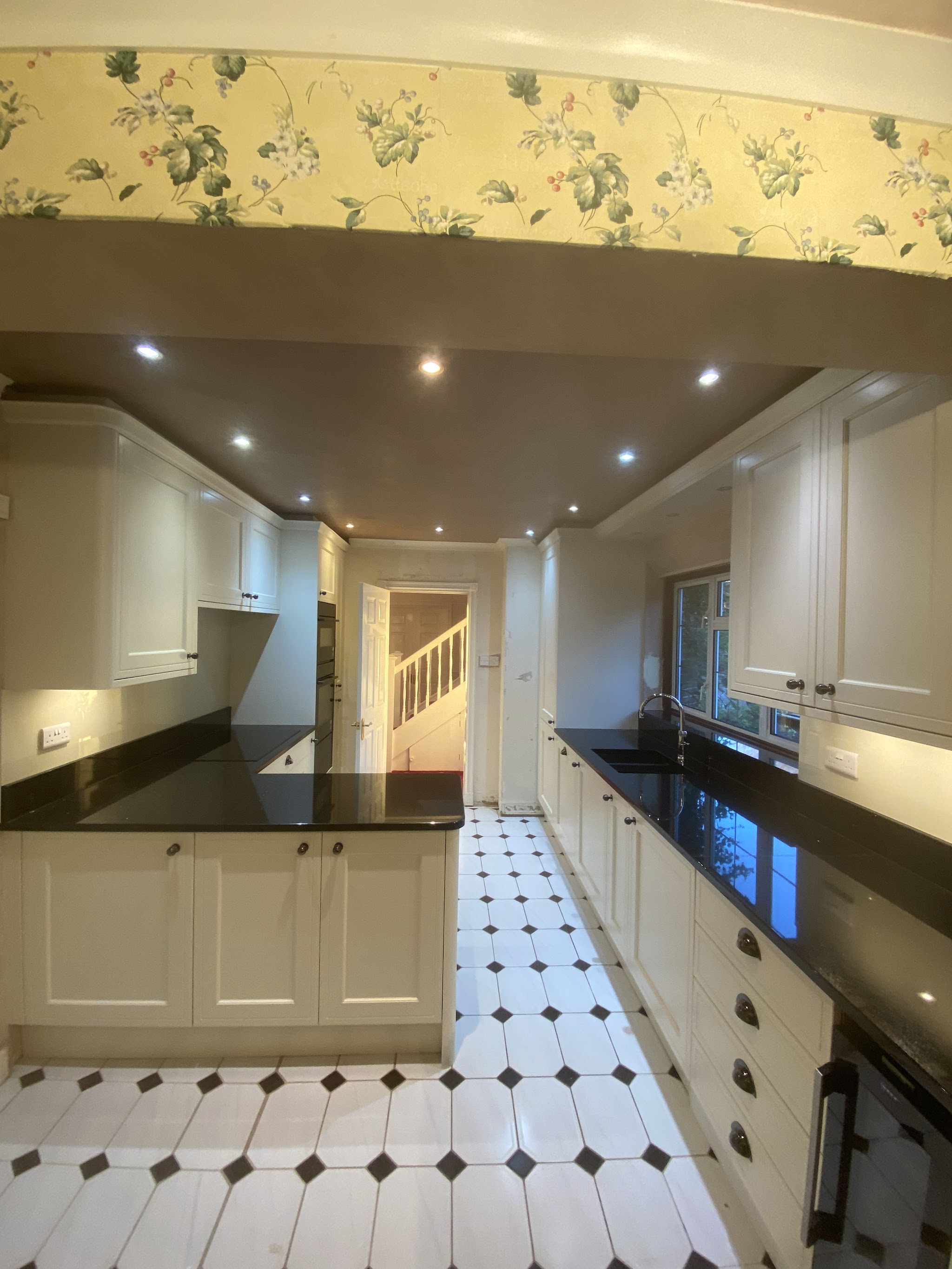 Finished kitchen with a smooth new ceiling and downlights